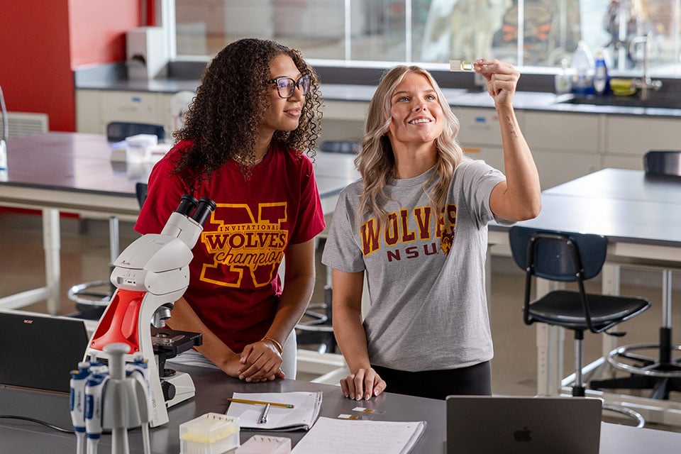 Two students working together in campus science lab